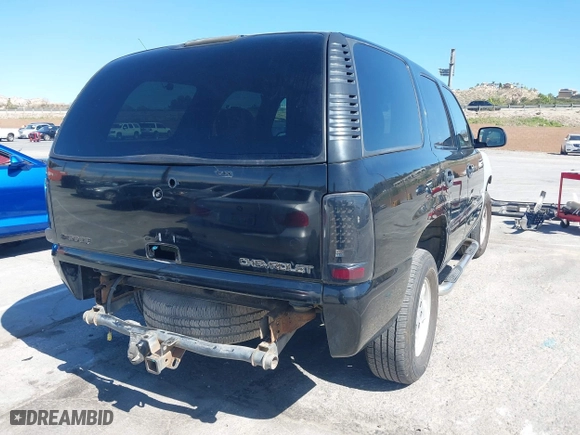 2001 Chevrolet Tahoe LT with VIN 1GNEC13T31R122882, listed as a IAAI auction lot 41999271 with 211,687 mi miles. Bid and sale history available at carsss.com. Image 4.