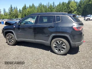 2017 Jeep Compass Trailhawk with VIN 3C4NJDDBXHT668053, listed as a Copart auction lot 63032155 with 94,090 mi miles and Salvage title. Bid and sale history available at DreamBid. Image 2.