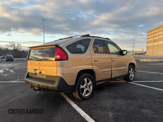 2002 Pontiac Aztek z VIN 3G7DB03E02S561022, wystawiony jako Copart lot #89014985 z przebiegiem 153 845 mil mil oraz Czysty tytuł • Clean title. Historia ofert i sprzedaży dostępna na DreamBid. Obrazek 4.