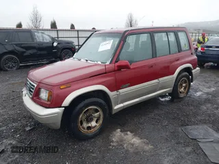 1996 Suzuki Sidekick z VIN JS3TD21V0T4107927, wystawiony jako IAAI lot #41249522 z przebiegiem 225 665 mil mil oraz . Historia ofert i sprzedaży dostępna na DreamBid. Obrazek 2.