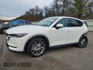 2021 Mazda CX-5 Signature with VIN JM3KFBEY5M0421694, listed as a Copart auction lot 85709714 with 28,126 mi miles and Salvage Title. Bid and sale history available at carsss.com. Image 1.