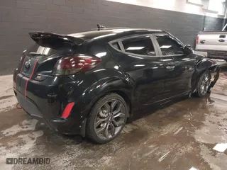2015 Hyundai Veloster RE:FLEX with VIN KMHTC6AD2FU223615, listed as a IAAI auction lot 41388773 with 111,381 mi miles. Bid and sale history available at carsss.com. Image 4.