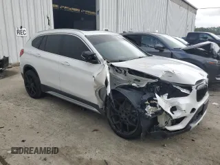 2019 BMW X1 xDrive28i with VIN WBXHT3C52K3H34021, listed as a Copart auction lot 64032535 with 30,752 mi miles and Salvage title. Bid and sale history available at DreamBid. Image 4.