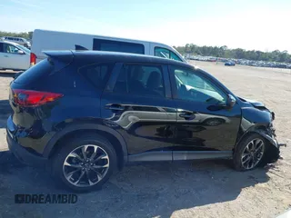 2016 Mazda CX-5 Grand Touring with VIN JM3KE4DY4G0677605, listed as a IAAI auction lot 41642893 with Not Provided miles and . Bid and sale history available at carsss.com. Image 13.