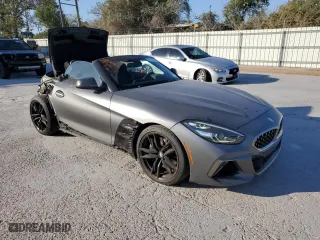 2020 BMW Z4 sDriveM40i with VIN WBAHF9C0XLWW63754, listed as a Copart auction lot 82302734 with 28,156 mi miles and Salvage Title. Bid and sale history available at carsss.com. Image 4.