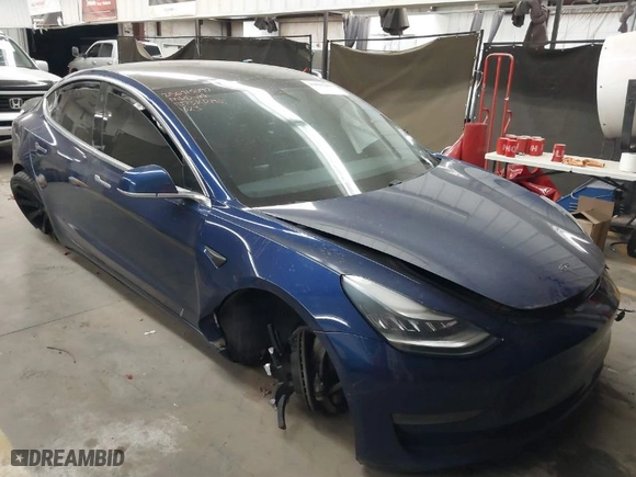 2019 Tesla Model 3 Mid Range with VIN 5YJ3E1EA8KF311623, listed as a IAAI auction lot 41835206 with 68,876 mi miles. Bid and sale history available at carsss.com. Image 1.