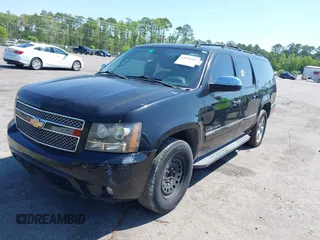 2011 Chevrolet Suburban LTZ with VIN 1GNSCKE01BR275919, listed as a IAAI auction lot 42038399 with 247,841 mi miles. Bid and sale history available at carsss.com. Image 2.