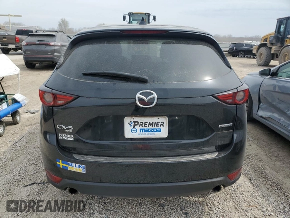 2021 Mazda CX-5 Grand Touring with VIN JM3KFBDM6M0401517, listed as a Copart auction lot 51019645 with 55,906 mi miles and Salvage Title. Bid and sale history available at DreamBid. Image 6.