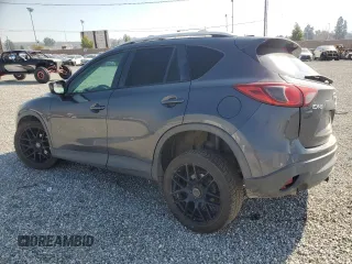 2014 Mazda CX-5 Touring with VIN JM3KE4CY6E0375084, listed as a Copart auction lot 46344065 with 143,828 mi miles and Salvage Title. Bid and sale history available at carsss.com. Image 2.