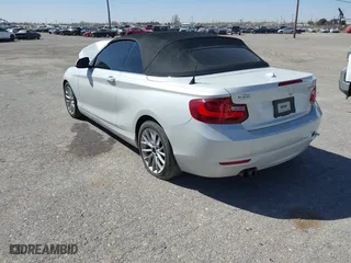 2015 BMW 2 Series 228i with VIN WBA1K5C50FV474011, listed as a IAAI auction lot 41805879 with 83,489 mi miles. Bid and sale history available at carsss.com. Image 3.