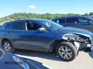 2015 Mazda CX-9 Sport z VIN JM3TB2BAXF0465720, wystawiony jako IAAI lot #42305436 z przebiegiem 130 543 mil mil oraz . Historia ofert i sprzedaży dostępna na DreamBid. Obrazek 13.