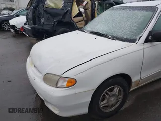 1999 Hyundai Accent z VIN KMHVF24N1XU583604, wystawiony jako IAAI lot #41613240 z przebiegiem 163 938 mil mil oraz . Historia ofert i sprzedaży dostępna na DreamBid. Obrazek 13.