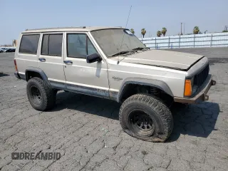 1996 Jeep Cherokee Sport with VIN 1J4FJ68S4TL146513, listed as a Copart auction lot 71039984 with 330,765 mi miles and Clean Title. Bid and sale history available at carsss.com. Image 4.