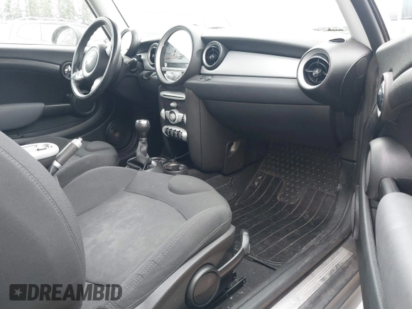 2007 MINI Hardtop with VIN WMWMF33557TU61953, listed as a IAAI auction lot 42678840 with 139,665 mi miles and . Bid and sale history available at DreamBid. Image 5.