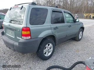 2007 Ford Escape XLT with VIN 1FMYU03107KA50631, listed as a IAAI auction lot 41374784 with 174,870 mi miles. Bid and sale history available at carsss.com. Image 4.