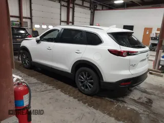 2022 Mazda CX-9 Sport z VIN JM3TCBBYXN0603653, wystawiony jako IAAI lot #42325893 z przebiegiem 57 480 mil mil oraz . Historia ofert i sprzedaży dostępna na DreamBid. Obrazek 3.