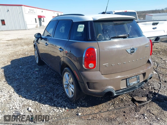 2014 MINI Countryman S with VIN WMWZC3C5XEWP52054, listed as a IAAI auction lot 41452354 with 104,873 mi miles and . Bid and sale history available at DreamBid. Image 3.
