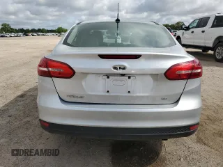 2017 Ford Focus SE with VIN 1FADP3F23HL328312, listed as a Copart auction lot 57028125 with 116,498 mi miles and Salvage title. Bid and sale history available at DreamBid. Image 6.