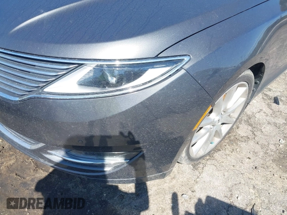 2016 Lincoln MKZ z VIN 3LN6L2G90GR632116, wystawiony jako IAAI lot #41836442 z przebiegiem 121 223 mil mil oraz . Historia ofert i sprzedaży dostępna na DreamBid. Obrazek 16.