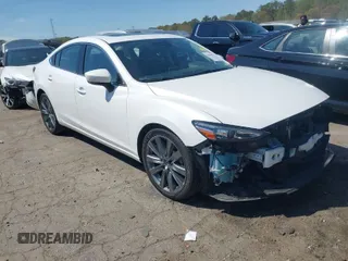 2019 Mazda 6 Touring with VIN JM1GL1VMXK1506052, listed as a IAAI auction lot 41810921 with 60,557 mi miles. Bid and sale history available at carsss.com. Image 1.