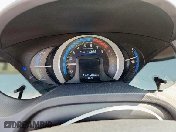 2010 Honda Insight LX with VIN JHMZE2H52AS043392, listed as a Copart auction lot 61347625 with 194,248 mi miles and Salvage title. Bid and sale history available at DreamBid. Image 9.