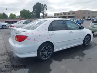 2004 Toyota Corolla CE with VIN JTDBR32E440052035, listed as a IAAI auction lot 42218301 with 299,999 mi miles. Bid and sale history available at carsss.com. Image 4.