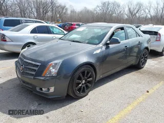 2009 Cadillac CTS RWD w/1SA with VIN 1G6DF577790133127, listed as a IAAI auction lot 41810358 with 220,278 mi miles. Bid and sale history available at carsss.com. Image 2.