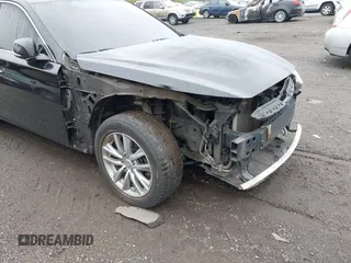 2014 Infiniti Q50 Premium z VIN JN1BV7AR2EM705630, wystawiony jako IAAI lot #42258650 z przebiegiem 109 151 mil mil oraz . Historia ofert i sprzedaży dostępna na DreamBid. Obrazek 17.