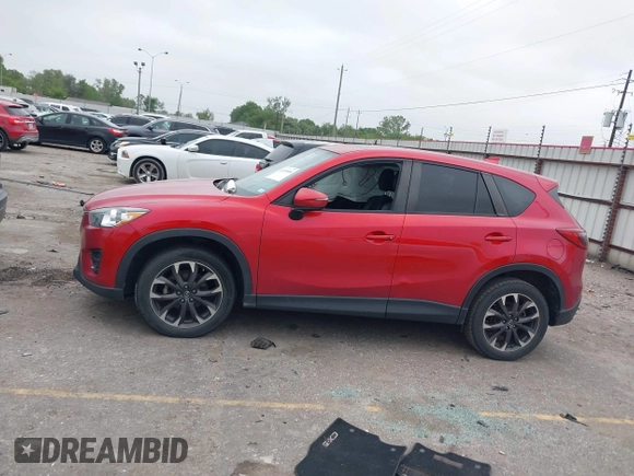 2016 Mazda CX-5 Grand Touring with VIN JM3KE2DY8G0871574, listed as a IAAI auction lot 41959686 with 95,416 mi miles and . Bid and sale history available at DreamBid. Image 14.