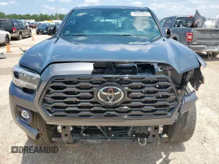 2023 Toyota Tacoma SR z VIN 3TMCZ5AN5PM598443, wystawiony jako Copart lot #60485035 z przebiegiem 18 842 mil mil oraz Szkoda całkowita • Salvage title. Historia ofert i sprzedaży dostępna na DreamBid. Obrazek 5.