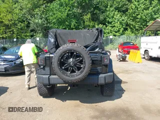 2015 Jeep Wrangler Unlimited Sport with VIN 1C4BJWDG2FL518487, listed as a IAAI auction lot 42593022 with 161,991 mi miles and . Bid and sale history available at DreamBid. Image 16.