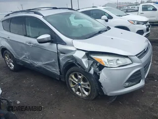 2013 Ford Escape SE with VIN 1FMCU0GX5DUA51847, listed as a IAAI auction lot 41897727 with 115,721 mi miles and . Bid and sale history available at DreamBid. Image 1.