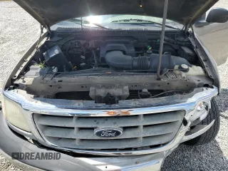 2001 Ford F-150 with VIN 1FTPX17L21NA37619, listed as a Copart auction lot 56922485 with 212,148 mi miles and Salvage title. Bid and sale history available at DreamBid. Image 11.