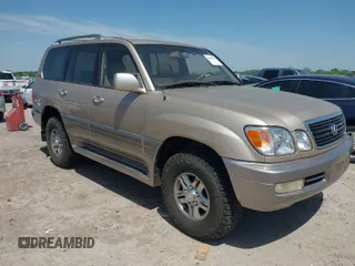 2001 Lexus LX 470 with VIN JTJHT00W613510736, listed as a IAAI auction lot 42005639 with 274,227 mi miles and . Bid and sale history available at carsss.com. Image 1.