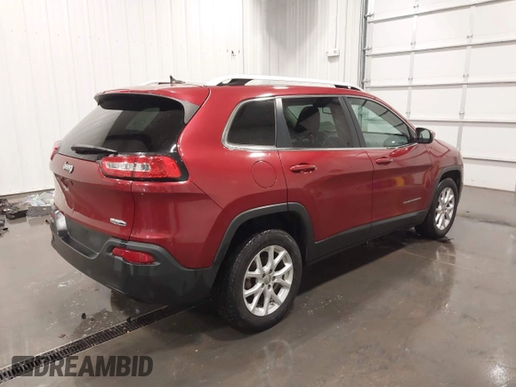 2015 Jeep Cherokee Latitude with VIN 1C4PJLCB6FW616477, listed as a IAAI auction lot 41812431 with 131,234 mi miles. Bid and sale history available at carsss.com. Image 4.