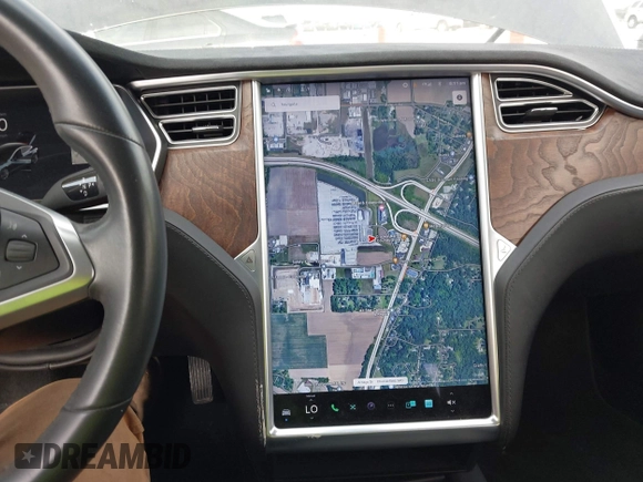 2017 Tesla Model S 100D with VIN 5YJSA1E28HF188981, listed as a IAAI auction lot 42010115 with 76,327 mi miles and . Bid and sale history available at DreamBid. Image 18.
