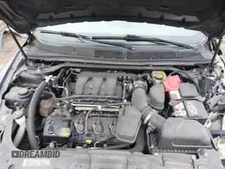 2014 Ford Taurus SEL with VIN 1FAHP2E80EG114996, listed as a IAAI auction lot 41908983 with 136,864 mi miles. Bid and sale history available at carsss.com. Image 10.