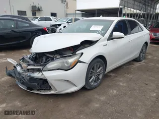 2015 Toyota Camry Hybrid LE with VIN 4T1BD1FK0FU175597, listed as a IAAI auction lot 41455315 with 116,380 mi miles. Bid and sale history available at carsss.com. Image 2.