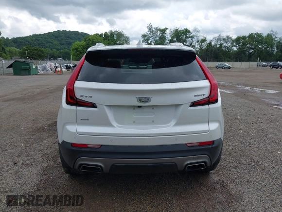 2022 Cadillac XT4 AWD Premium Luxury z VIN 1GYFZDR42NF128199, wystawiony jako IAAI lot #42522314 z przebiegiem 29 002 mil mil oraz . Historia ofert i sprzedaży dostępna na DreamBid. Obrazek 16.