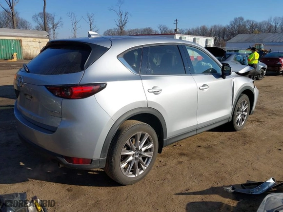 2021 Mazda CX-5 Grand Touring with VIN JM3KFADM7M1328341, listed as a IAAI auction lot 41660906 with 109,417 mi miles. Bid and sale history available at carsss.com. Image 4.