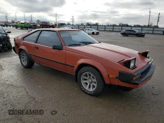 1983 Toyota Supra z VIN JT2MA67L9D0056034, wystawiony jako Copart lot #82382484 z przebiegiem 39 338 mil mil oraz Szkoda całkowita • Salvage title. Historia ofert i sprzedaży dostępna na DreamBid. Obrazek 4.
