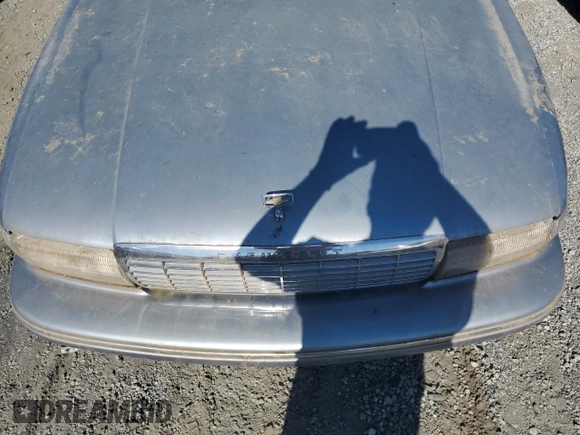 1994 Chevrolet Caprice z VIN 1G1BL52W4RR114969, wystawiony jako Copart lot #76950754 z przebiegiem Nie podano mil oraz Szkoda całkowita • Salvage title. Historia ofert i sprzedaży dostępna na DreamBid. Obrazek 11.