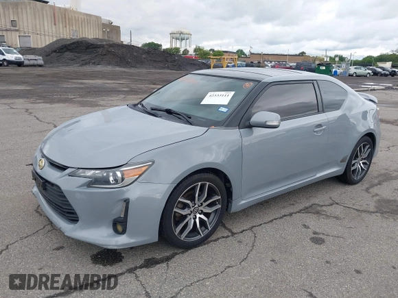 2014 Scion tC z VIN JTKJF5C71E3081033, wystawiony jako IAAI lot #42333111 z przebiegiem 144 124 mil mil oraz . Historia ofert i sprzedaży dostępna na DreamBid. Obrazek 2.
