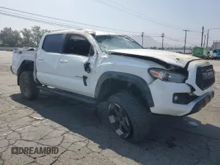 2017 Toyota Tacoma SR5 with VIN 3TMCZ5AN7HM065026, listed as a Copart auction lot 60438365 with 122,329 mi miles and Salvage title. Bid and sale history available at DreamBid. Image 4.
