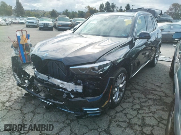 2022 BMW X5 xDrive45e with VIN 5UXTA6C01N9M84108, listed as a Copart auction lot 65150782 with 5,977 mi miles. Bid and sale history available at carsss.com. Image 2.