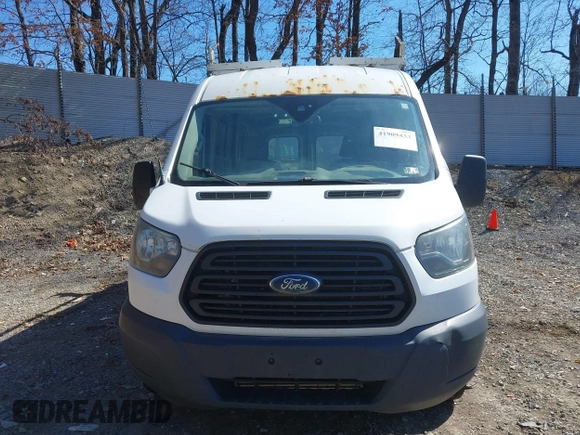 2016 Ford Transit Cargo z VIN 1FTYR2CG4GKA82911, wystawiony jako IAAI lot #41909433 z przebiegiem Nie podano mil oraz . Historia ofert i sprzedaży dostępna na DreamBid. Obrazek 13.