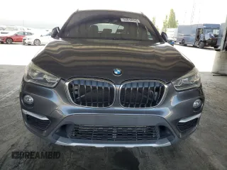 2016 BMW X1 xDrive28i with VIN WBXHT3Z38G4A49061, listed as a Copart auction lot 54010455 with 120,875 mi miles and Salvage Title. Bid and sale history available at DreamBid. Image 5.
