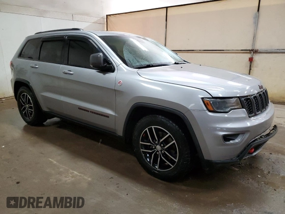 2017 Jeep Grand Cherokee Trailhawk with VIN 1C4RJFLG8HC618709, listed as a Copart auction lot 52899194 with 69,000 mi miles and Salvage title. Bid and sale history available at DreamBid. Image 4.