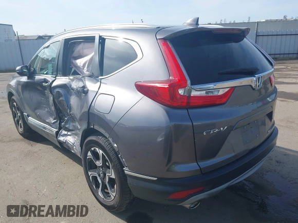 2018 Honda CR-V Touring with VIN 7FARW1H93JE027294, listed as a IAAI auction lot 41903484 with 80,999 mi miles and . Bid and sale history available at DreamBid. Image 3.