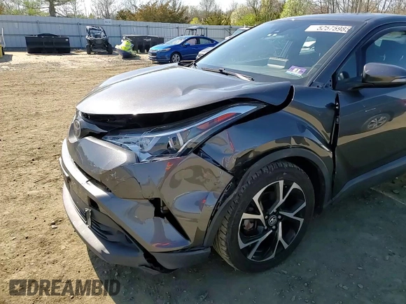 2019 Toyota C-HR XLE z VIN NMTKHMBX4KR084471, wystawiony jako Copart lot #52575985 z przebiegiem 54 578 mil mil oraz Szkoda całkowita • Salvage title. Historia ofert i sprzedaży dostępna na DreamBid. Obrazek 11.